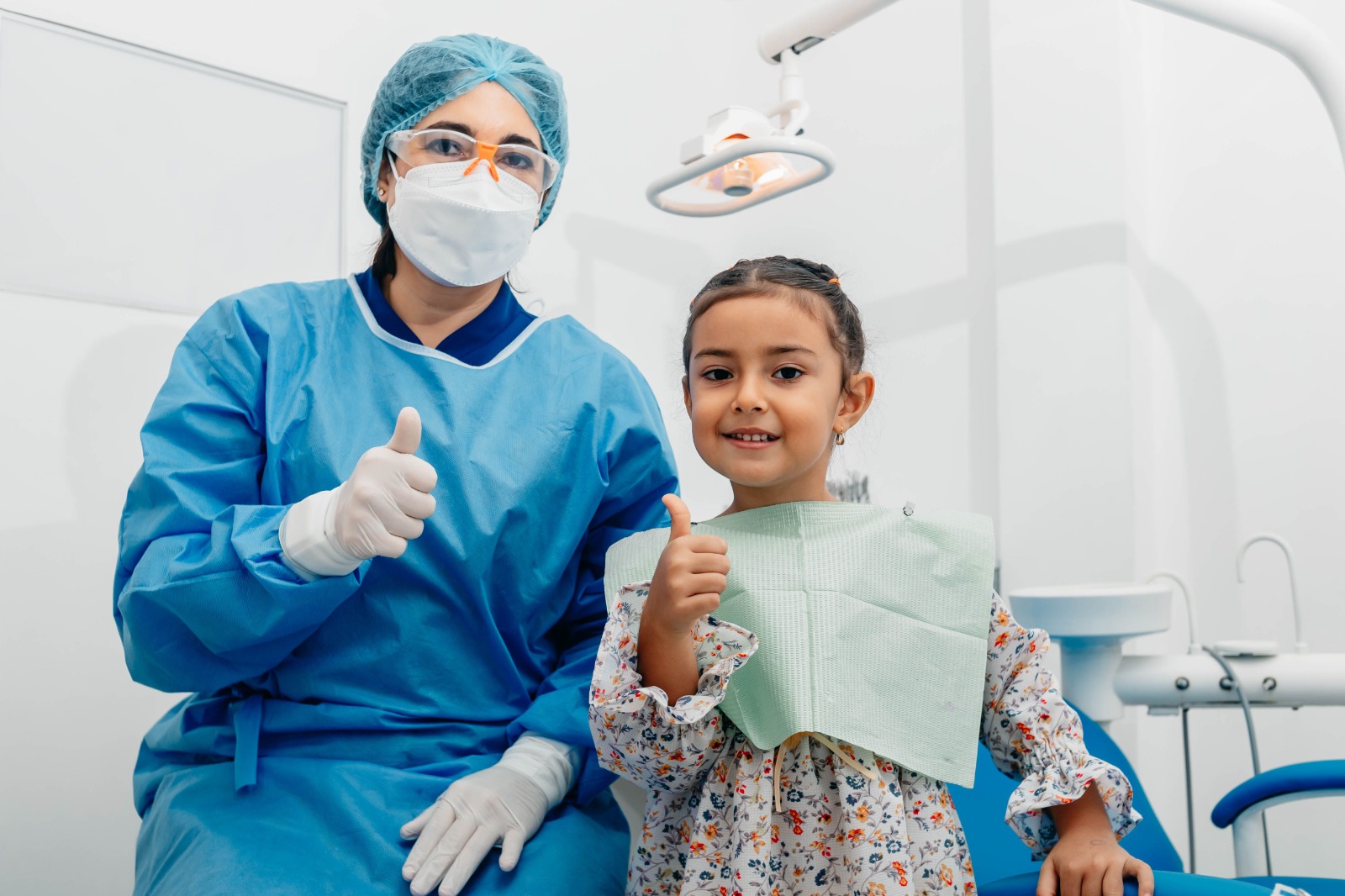 Child smiling happily at the dentist
